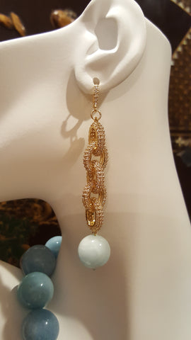 Beautiful Aquamarine with 18k gold plated pave links & huggy clasp adorn these earrings reminiscent of the Carribean Sea. 